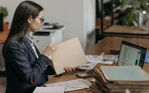 Compliance officer reviewing customer identity, beneficial ownership, and transaction activity for a cash-intensive business under CDD requirements.